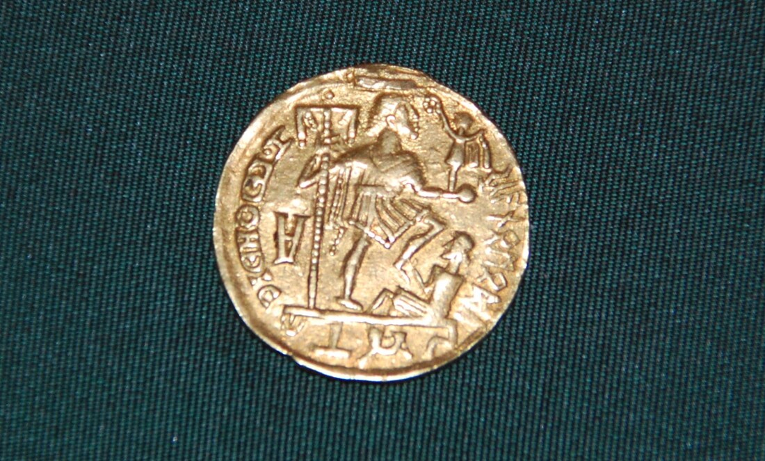 The Skanomodu solidus showing runic inscription on early medieval gold coin